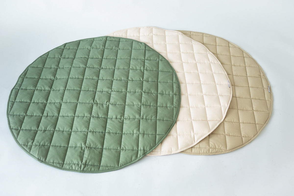 Neutral Round Baby Play Mats in olive, blush and taupe fanned out