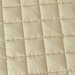 Close-up of the square quilting on the 100% cotton Neutral Round Baby Play Mat