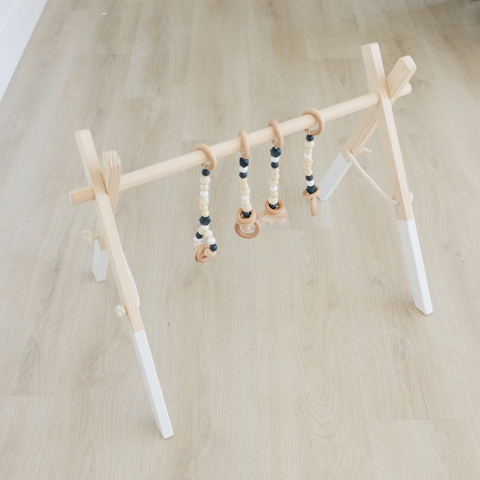 Wooden Baby Gym + Black Toys  - Poppyseed Play